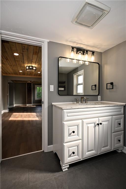 485 Wendel Road Irwin, PA 15642 - Photo 13 of 30 a bathroom with a sink a mirror and a toilet