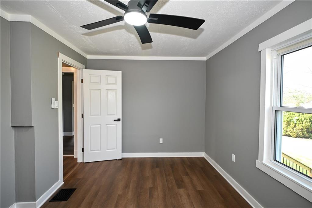 485 Wendel Road Irwin, PA 15642 - Photo 16 of 30 a view of an empty room with wooden floor and a window