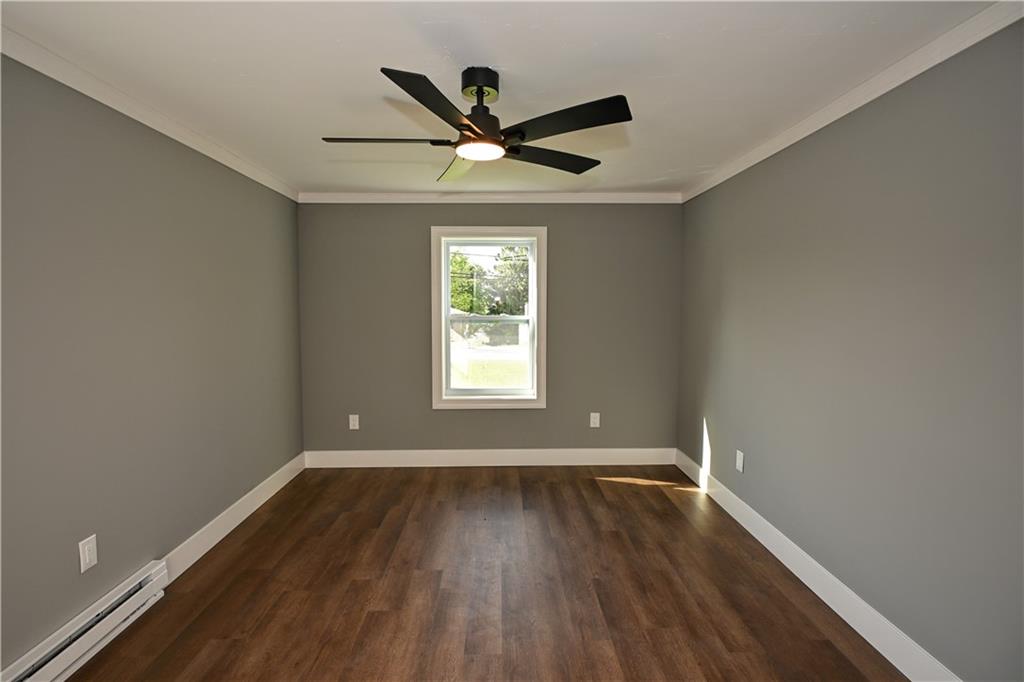 485 Wendel Road Irwin, PA 15642 - Photo 18 of 30 wooden floor in an empty room with a window