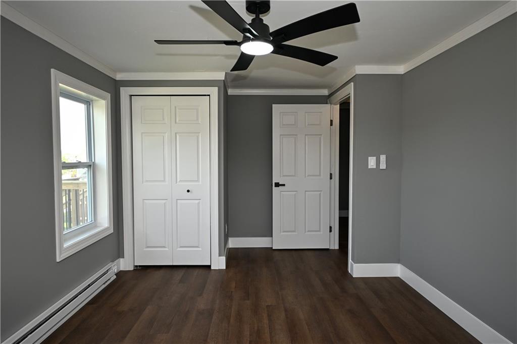 485 Wendel Road Irwin, PA 15642 - Photo 21 of 30 a view of an empty room with window and wooden floor