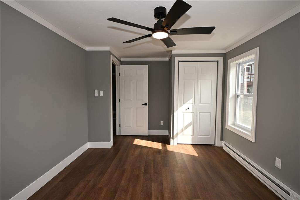 485 Wendel Road Irwin, PA 15642 - Photo 22 of 30 an empty room with wooden floor and windows