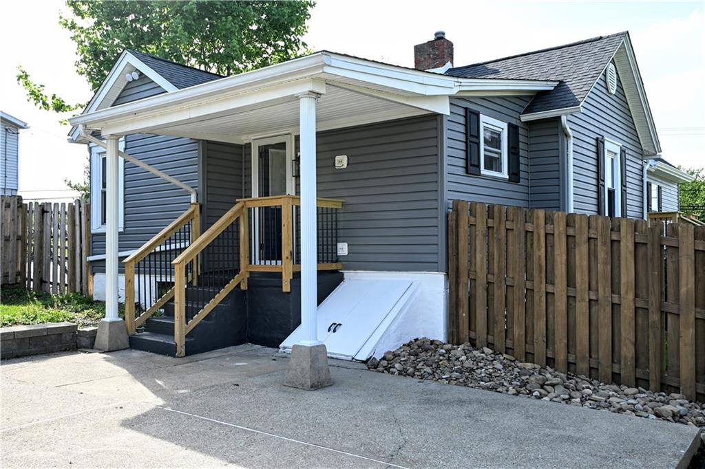 485 Wendel Road Irwin, PA 15642 - Photo 5 of 30 a front view of a house with a wooden fence