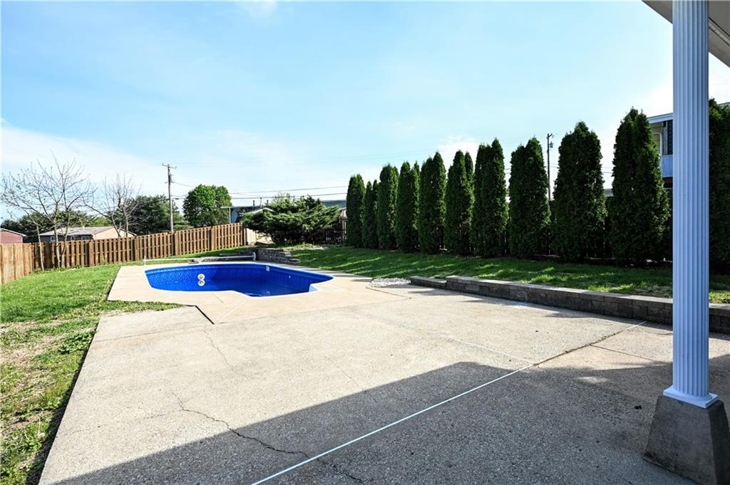 485 Wendel Road Irwin, PA 15642 - Photo 6 of 30 a view of outdoor space with swimming pool and trees in the background