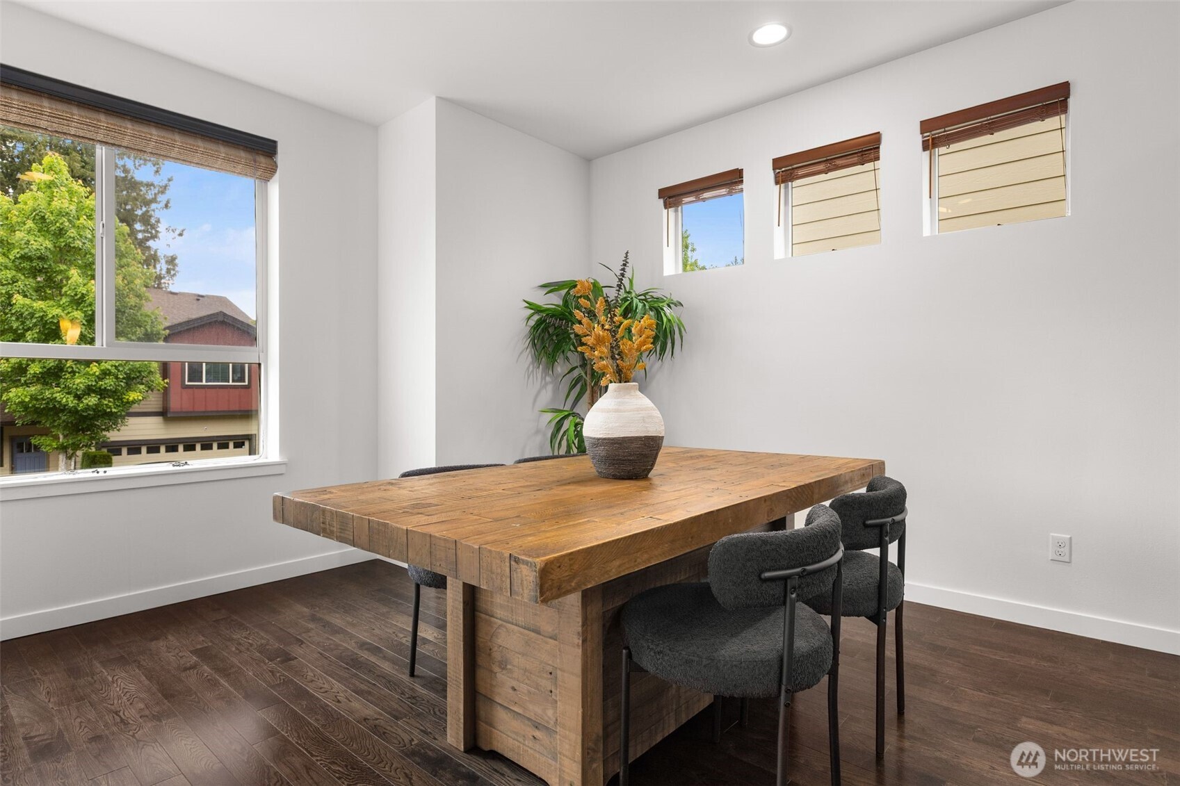 16516 2nd Park Southeast Bothell, WA 98012 - Photo 13 of 39 a view of a dining room with furniture and a potted plant