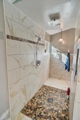 a bathroom with a bathtub and a shower