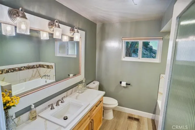 a bathroom with a sink and mirror