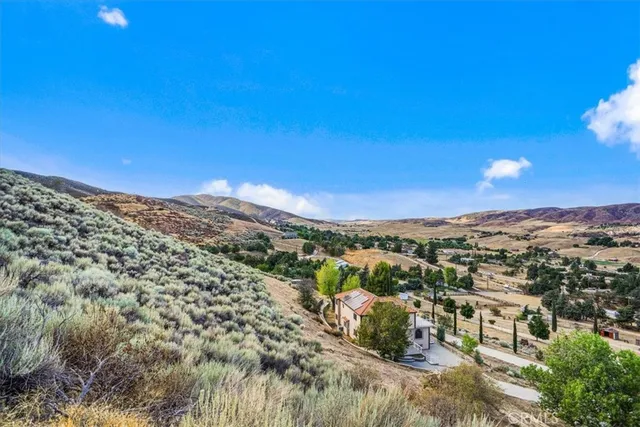 a view of a city with mountains in the background