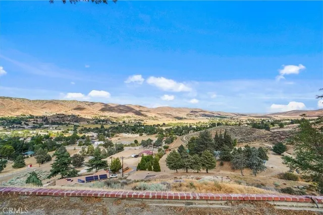 a view of a city with mountains in the background