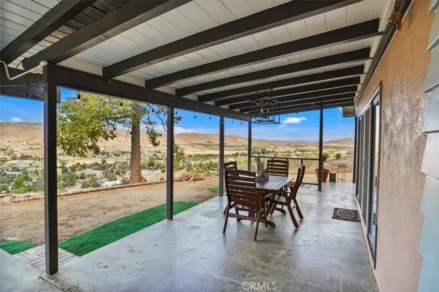 a large white kitchen with cabinets