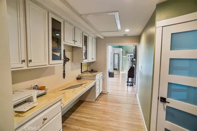 a bedroom with a bed couch and a window