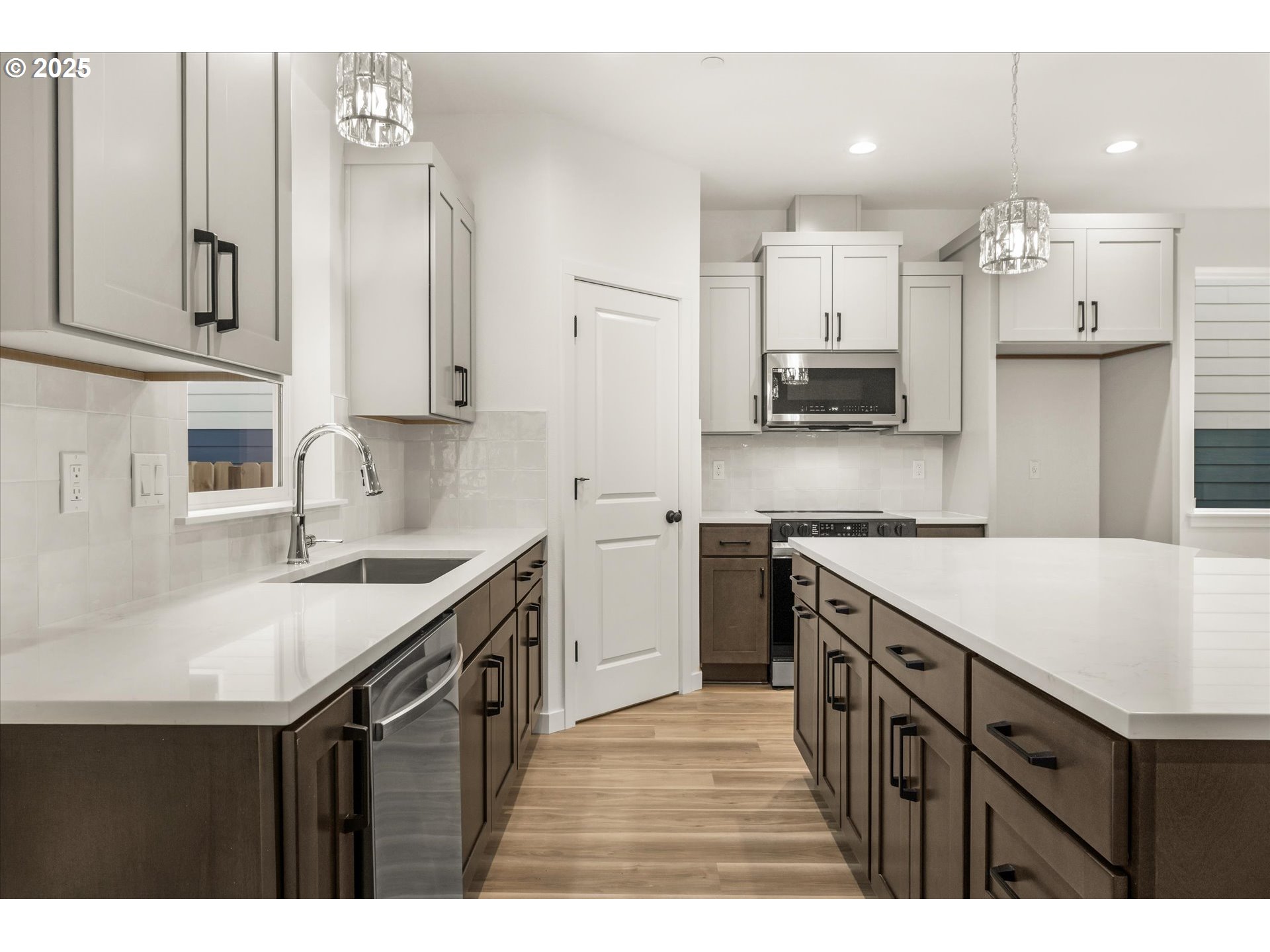 284 Northwest Mawrcrest Drive Gresham, OR 97030 - Photo 11 of 37 a kitchen with a sink a stove a refrigerator and a cabinets