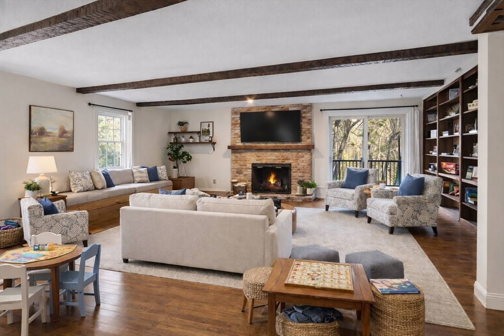 31 Mohawk Road Andover, MA 01810 - Photo 11 of 33 a living room with furniture fireplace and a flat screen tv