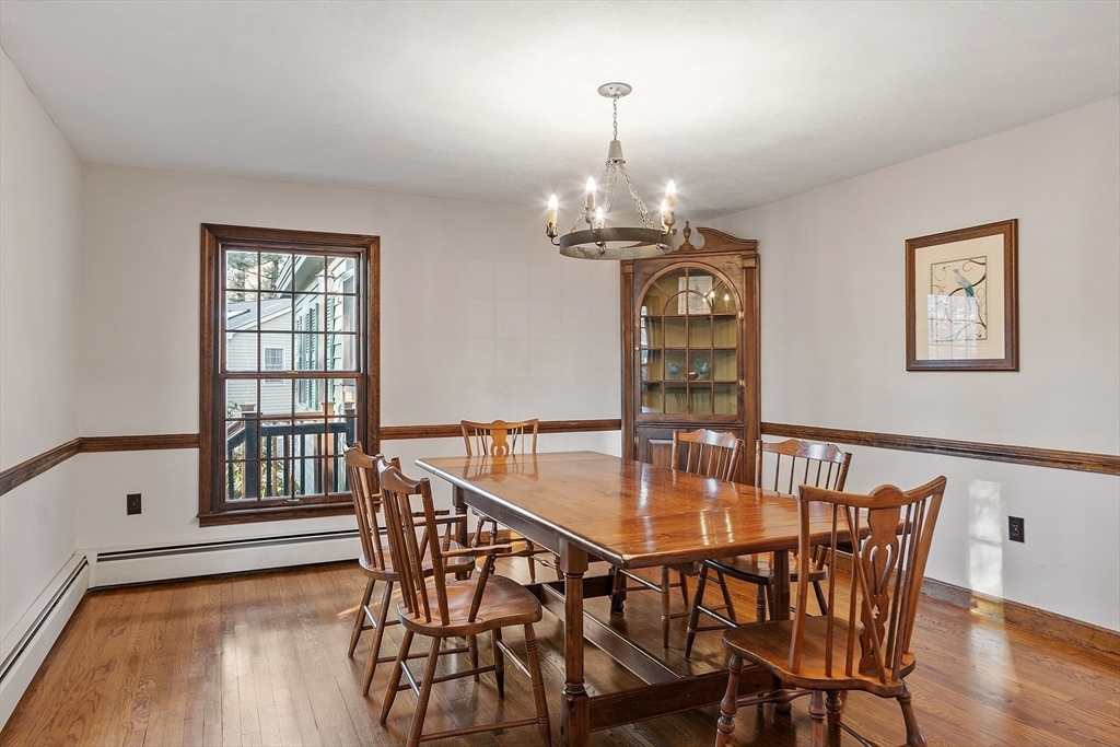 31 Mohawk Road Andover, MA 01810 - Photo 19 of 33 a view of a dining room with furniture wooden floor and chandelier