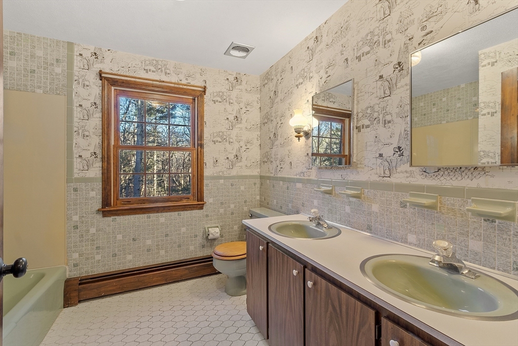 31 Mohawk Road Andover, MA 01810 - Photo 25 of 33 a bathroom with a sink and a mirror