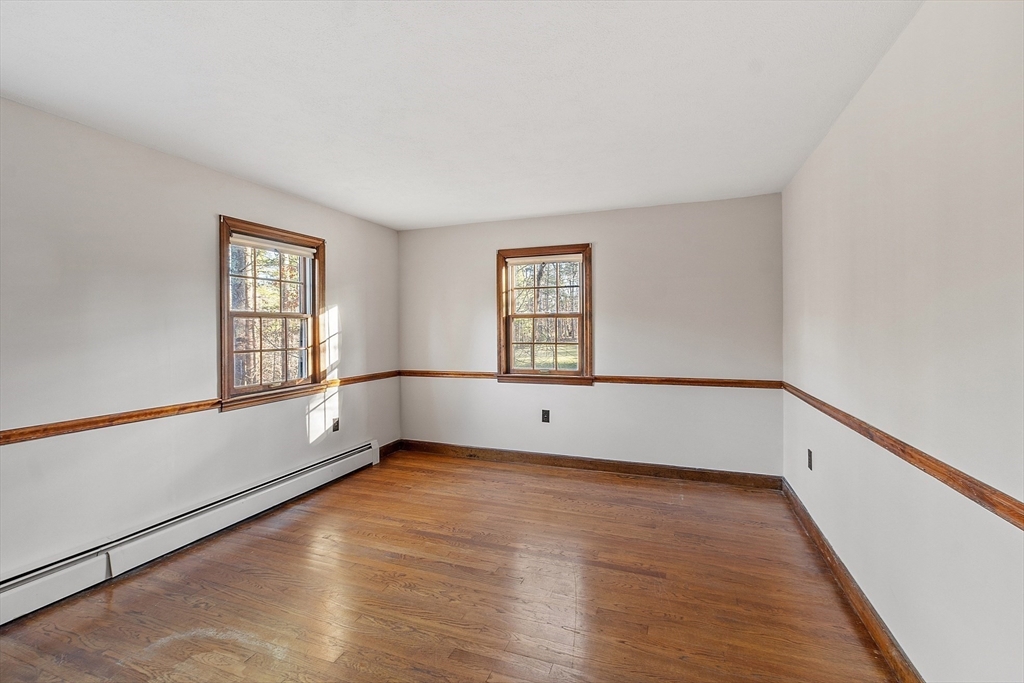 31 Mohawk Road Andover, MA 01810 - Photo 26 of 33 an empty room with wooden floor and windows