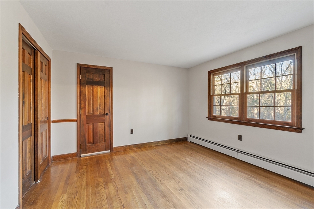 31 Mohawk Road Andover, MA 01810 - Photo 27 of 33 a view of an empty room with wooden floor and a window