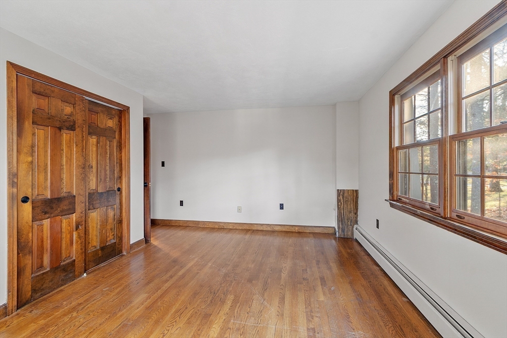 31 Mohawk Road Andover, MA 01810 - Photo 28 of 33 wooden floor in an empty room with a window