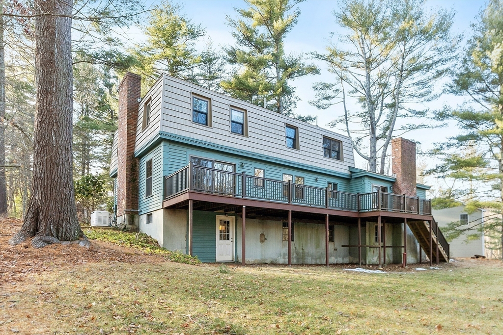 31 Mohawk Road Andover, MA 01810 - Photo 4 of 33 a front view of a house with large trees
