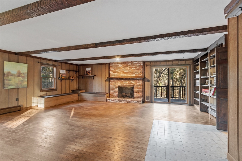 31 Mohawk Road Andover, MA 01810 - Photo 7 of 33 a view of an empty room with a window and wooden floor