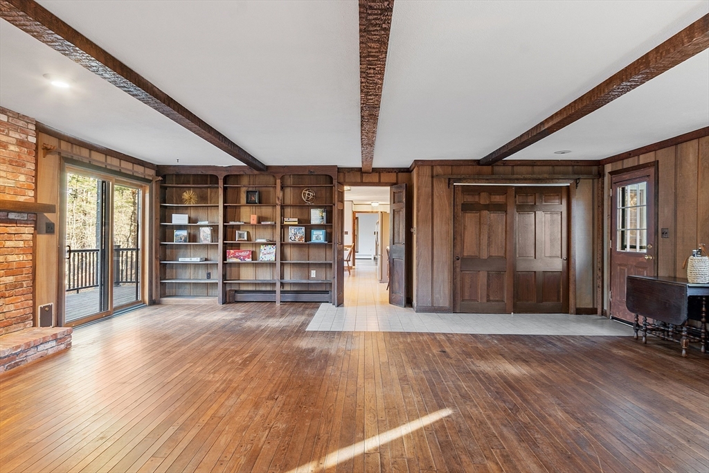 31 Mohawk Road Andover, MA 01810 - Photo 10 of 33 a big room with wooden floor and windows
