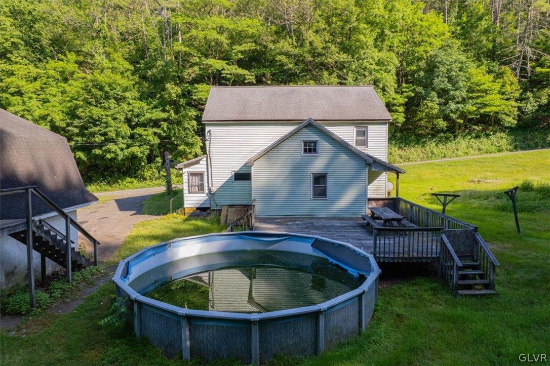 130 Christman Road Kunkletown, PA 18058 - Photo 14 of 44 a view of backyard with swimming pool and outdoor seating