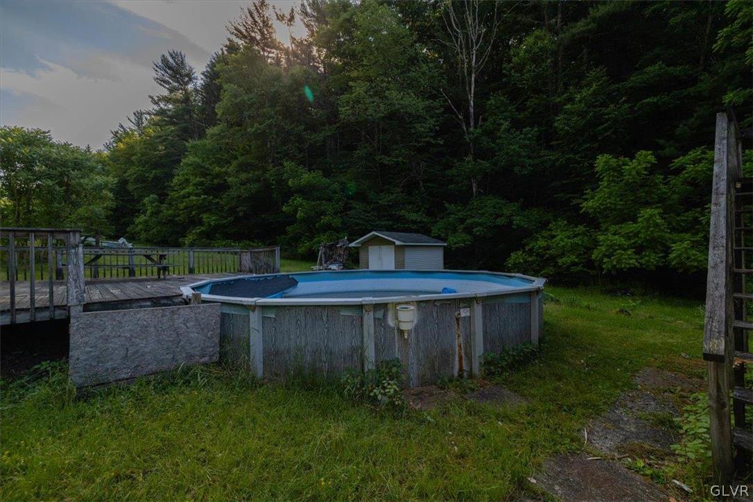 130 Christman Road Kunkletown, PA 18058 - Photo 15 of 44 a view of a backyard with barn plants and large trees