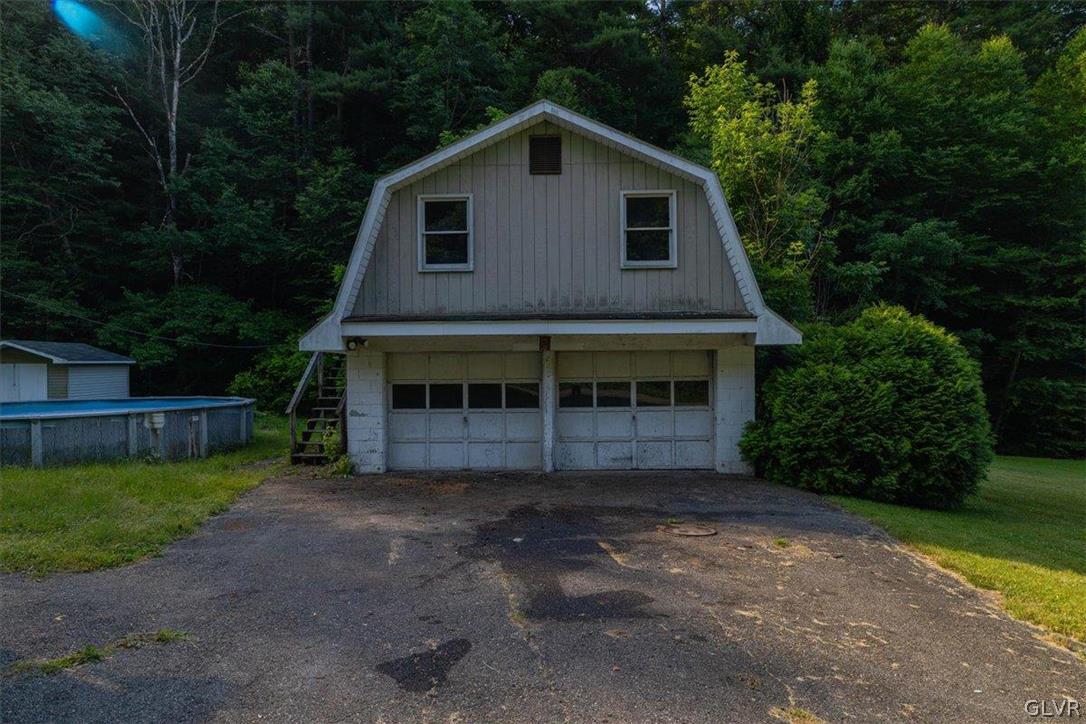130 Christman Road Kunkletown, PA 18058 - Photo 22 of 44 a front view of a house with a garden