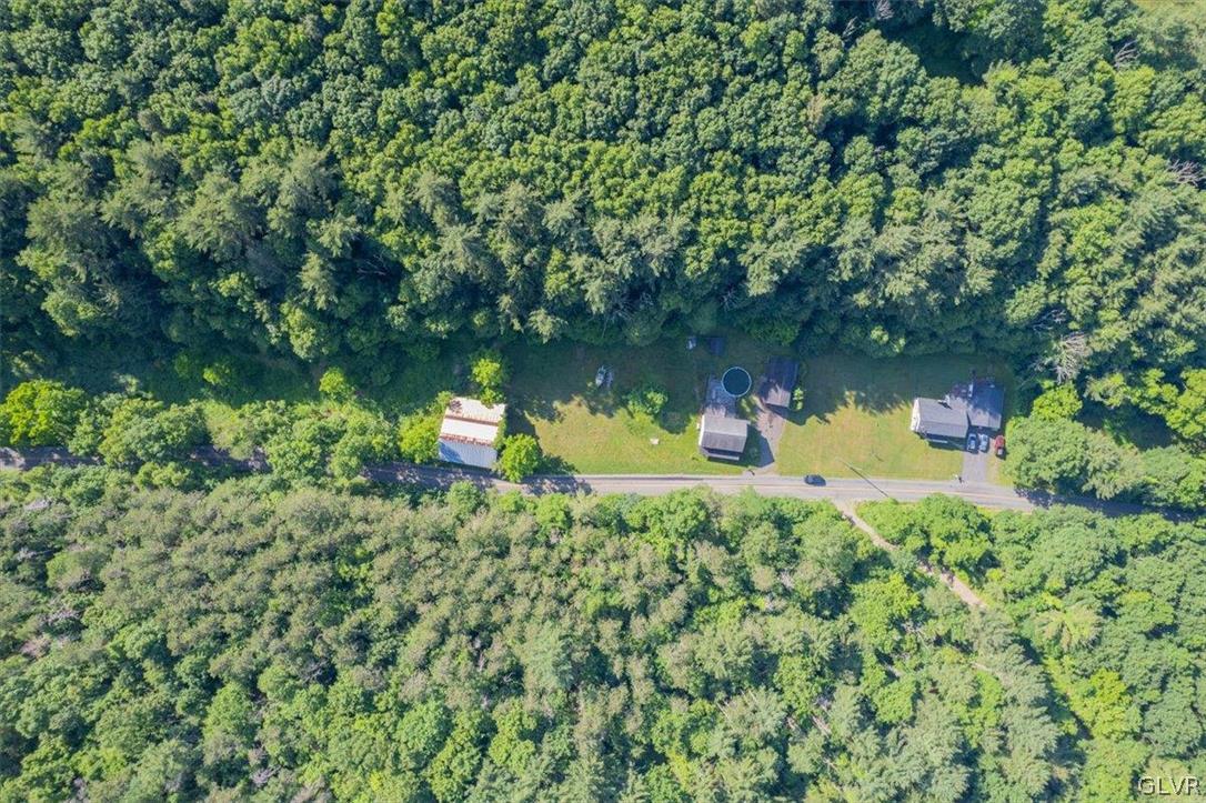 130 Christman Road Kunkletown, PA 18058 - Photo 40 of 44 an aerial view of a house with a yard and large trees
