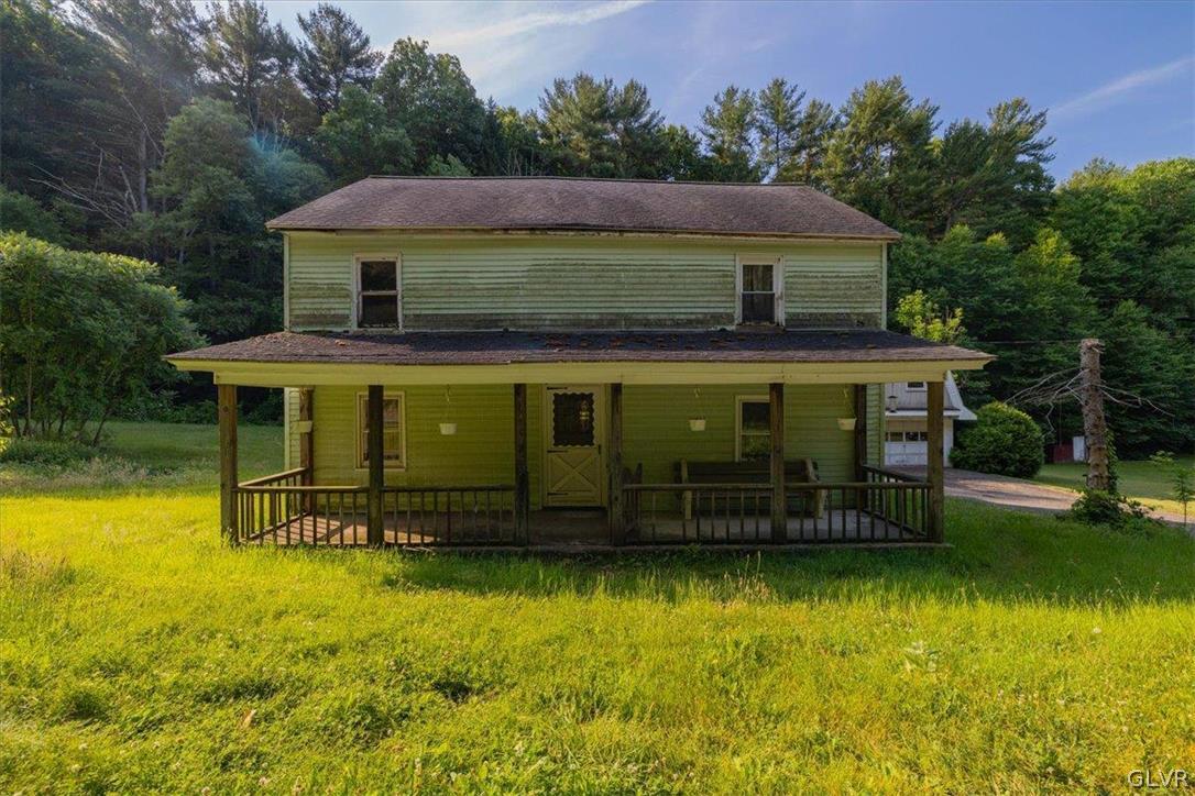 130 Christman Road Kunkletown, PA 18058 - Photo 6 of 44 a front view of a house with a yard table and chairs