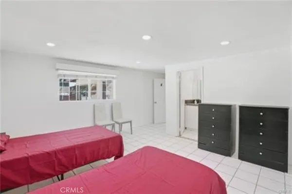 a bedroom with a bed and a dresser