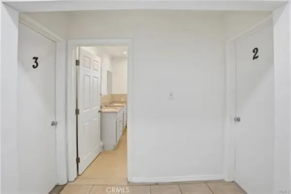 a bathroom with a double vanity sink mirror and shower
