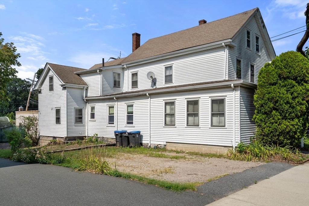 49 Summer Street Natick, MA 01760 - Photo 2 of 39 a front view of a house with a yard