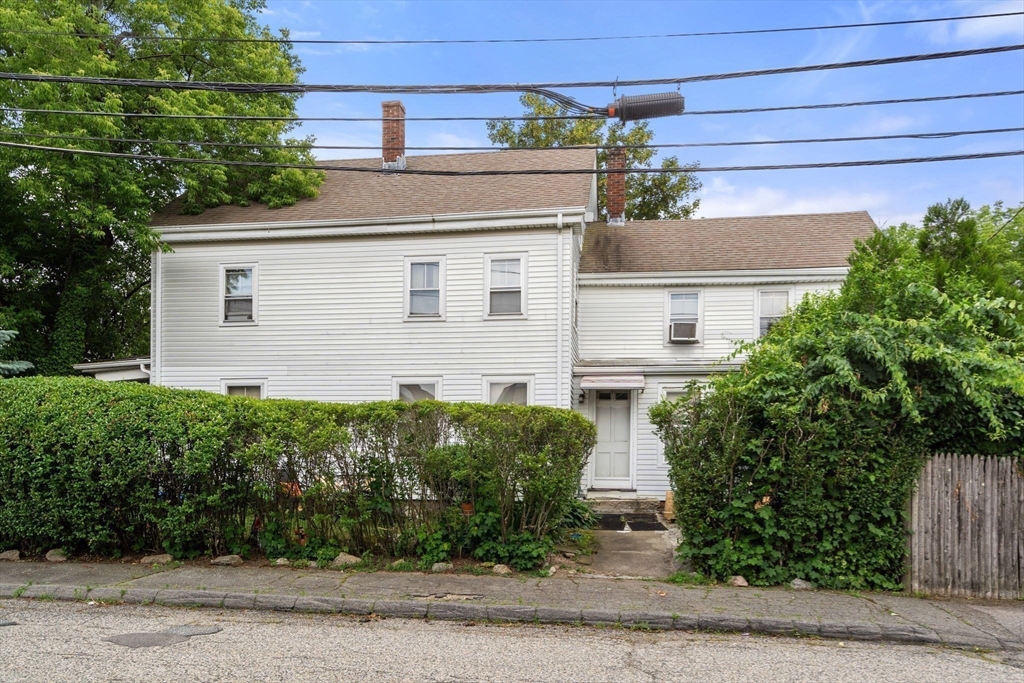 49 Summer Street Natick, MA 01760 - Photo 25 of 39 a front view of a house with garden