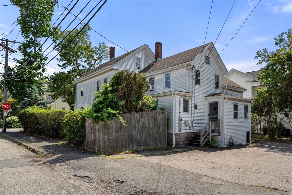 49 Summer Street Natick, MA 01760 - Photo 28 of 39 a front view of a house with a garden