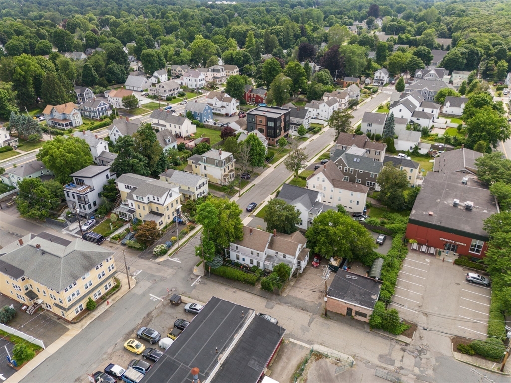 49 Summer Street Natick, MA 01760 - Photo 33 of 39 an aerial view of multiple houses with yard