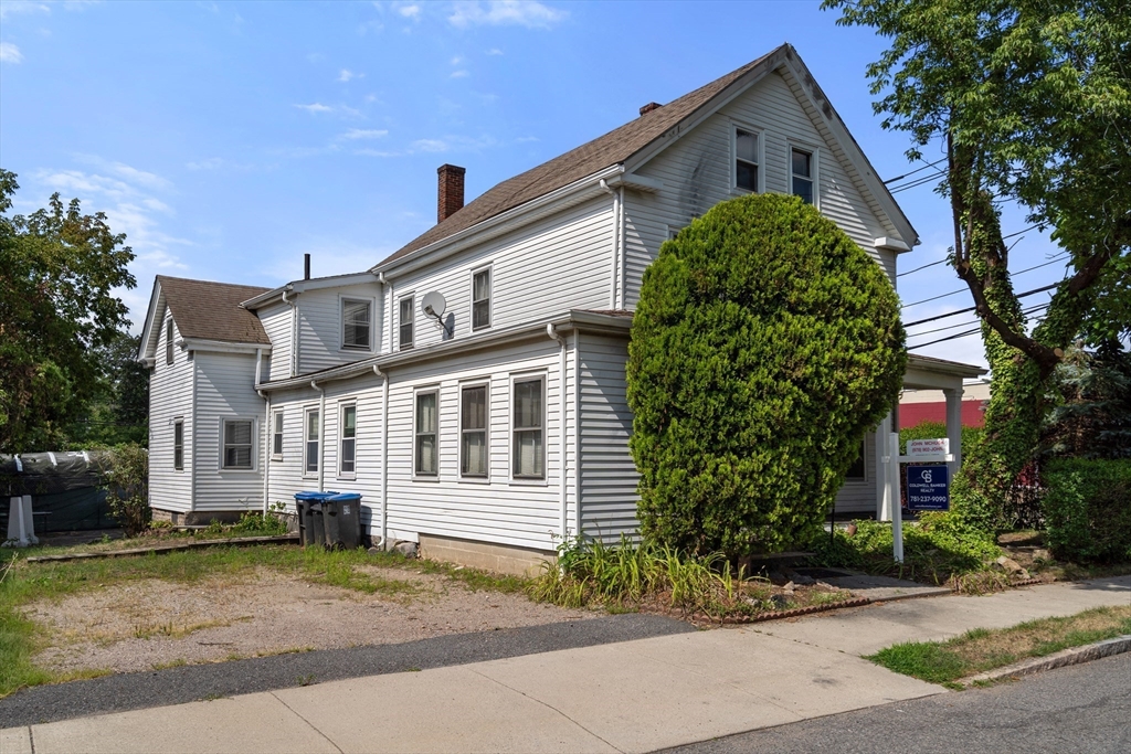 49 Summer Street Natick, MA 01760 - Photo 35 of 39 a front view of a house with a garden