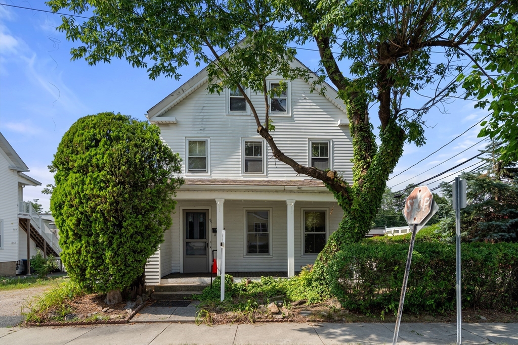 49 Summer Street Natick, MA 01760 - Photo 37 of 39 a front view of a house with plants and trees