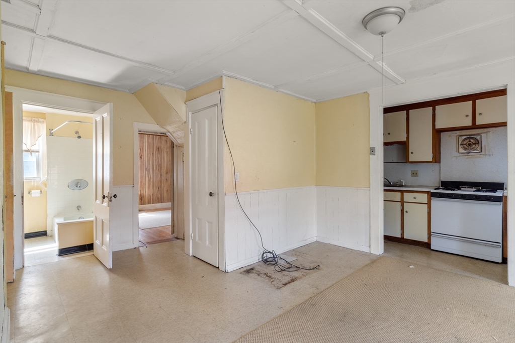 49 Summer Street Natick, MA 01760 - Photo 8 of 39 a spacious bathroom with a granite countertop sink and a mirror