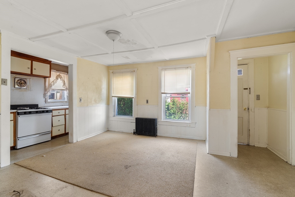 49 Summer Street Natick, MA 01760 - Photo 9 of 39 a view of a kitchen with an entryway and kitchen area