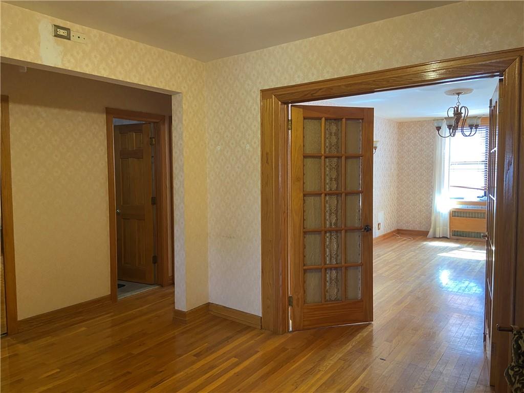 7259 Shore Road, Unit 2K Brooklyn, NY 11209 - Photo 13 of 19 an empty room with wooden floor and closet