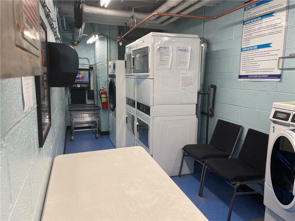 7259 Shore Road, Unit 2K Brooklyn, NY 11209 - Photo 18 of 19 a living room with furniture and a flat screen tv