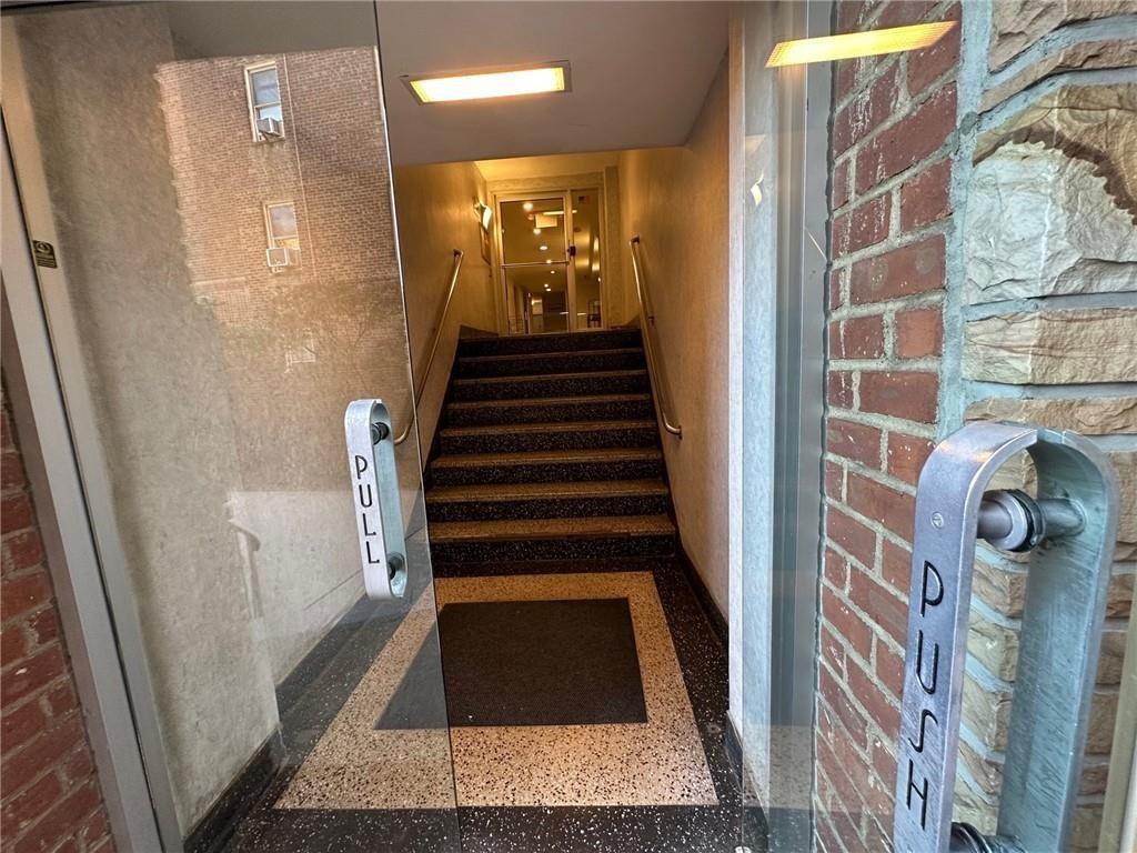 7259 Shore Road, Unit 2K Brooklyn, NY 11209 - Photo 4 of 19 a view of a hallway with entryway door