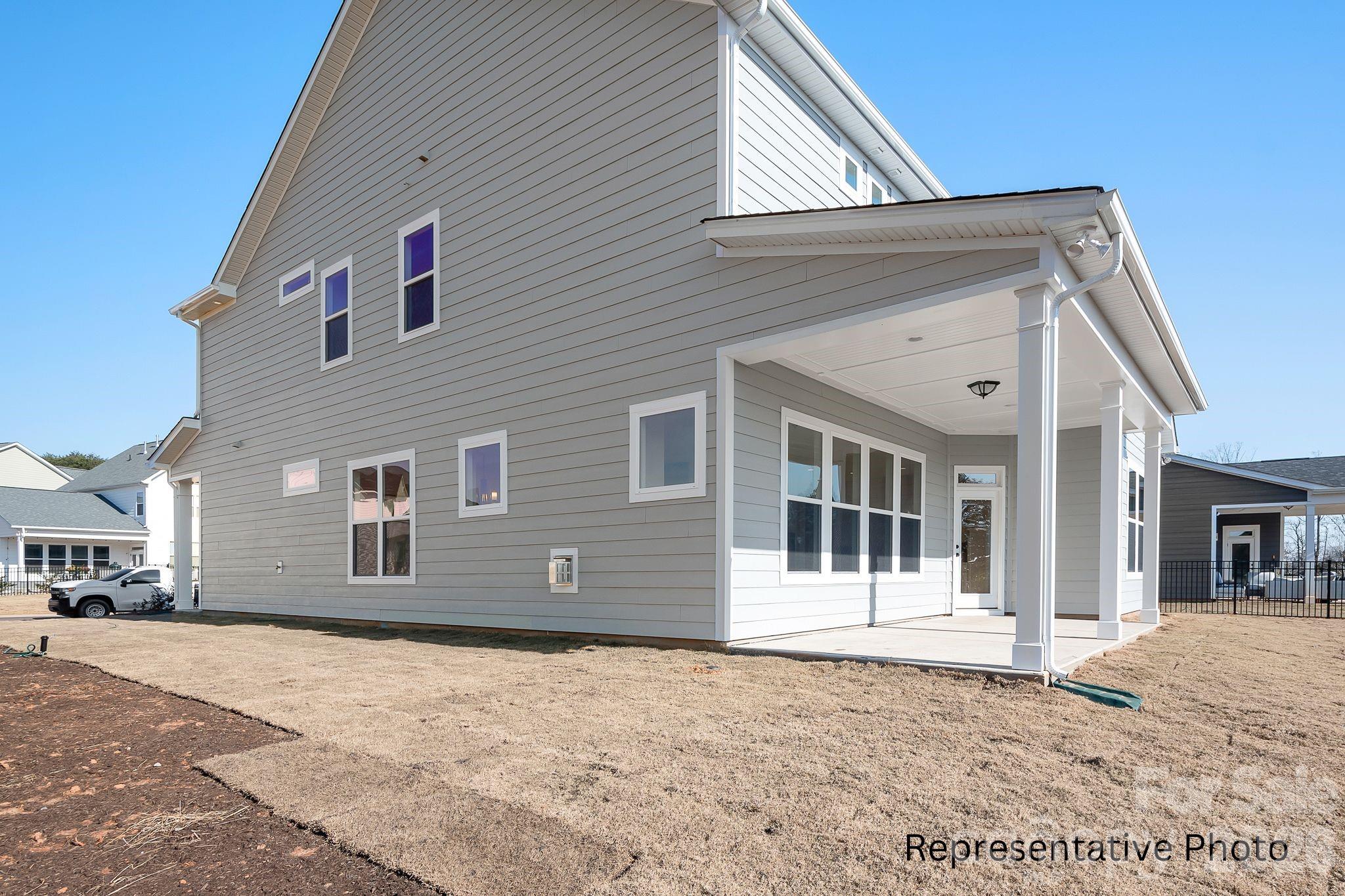 4172 Millstream Road, Unit 137 Denver, NC 28037 - Photo 26 of 28 a front view of a house with a outdoor space