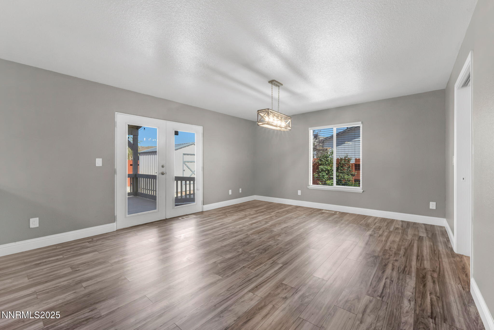 17391 Crystal Canyon Boulevard Reno, NV 89508 - Photo 11 of 63 wooden floor in an empty room with a window