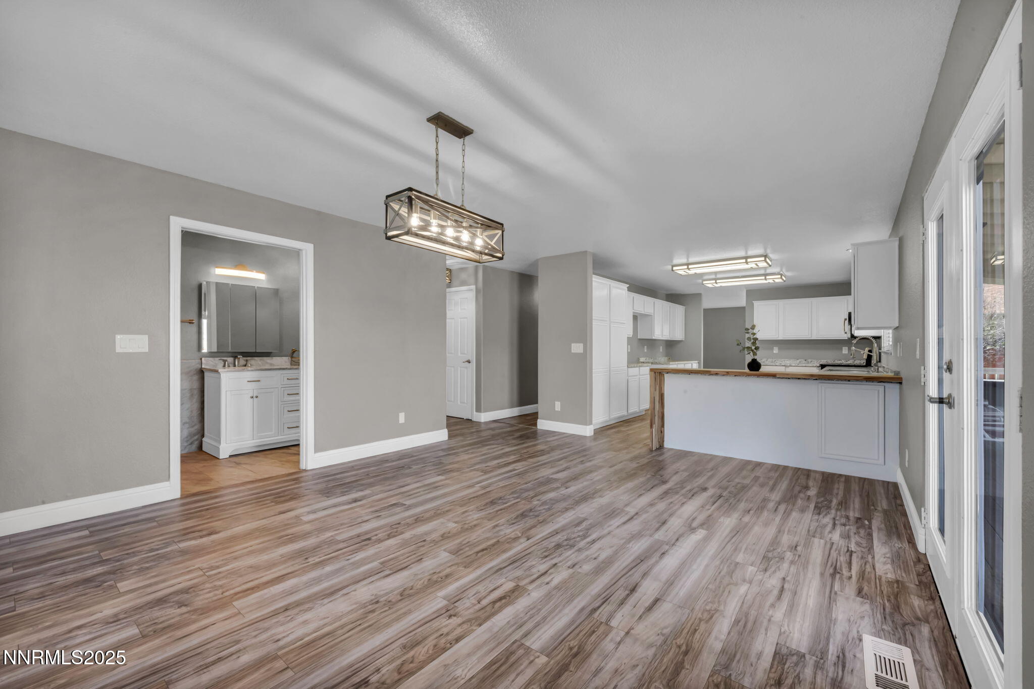 17391 Crystal Canyon Boulevard Reno, NV 89508 - Photo 12 of 63 a view of a kitchen with wooden floor and a sink