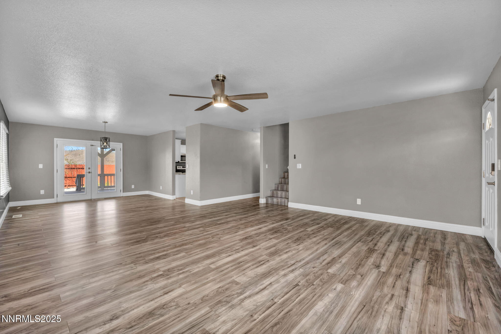 17391 Crystal Canyon Boulevard Reno, NV 89508 - Photo 17 of 63 wooden floor in an empty room with a window