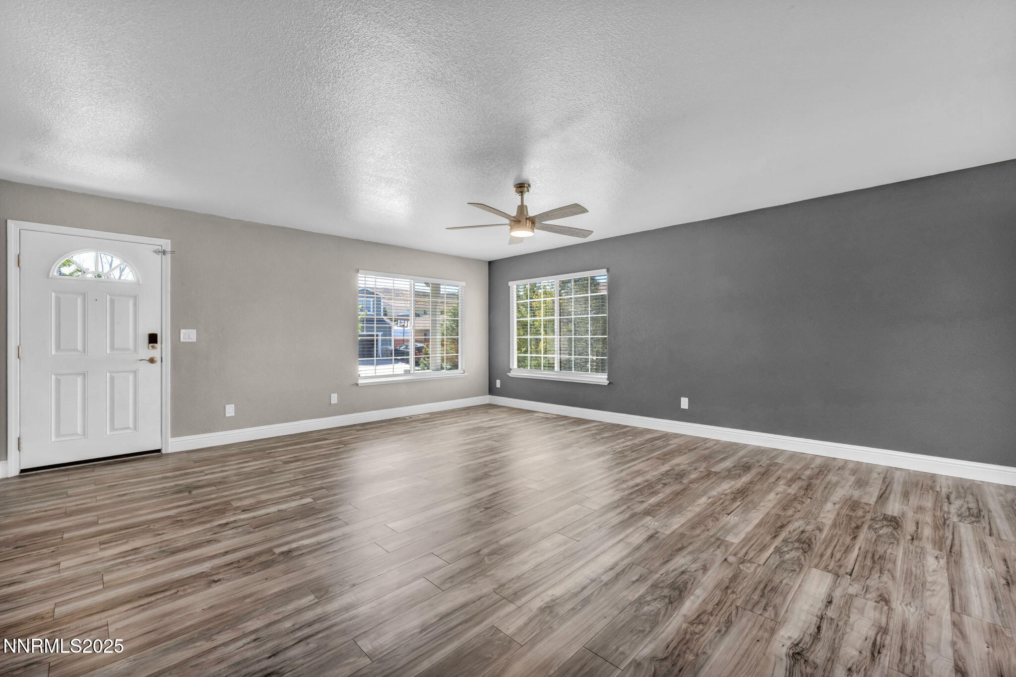 17391 Crystal Canyon Boulevard Reno, NV 89508 - Photo 20 of 63 wooden floor in an empty room with a window