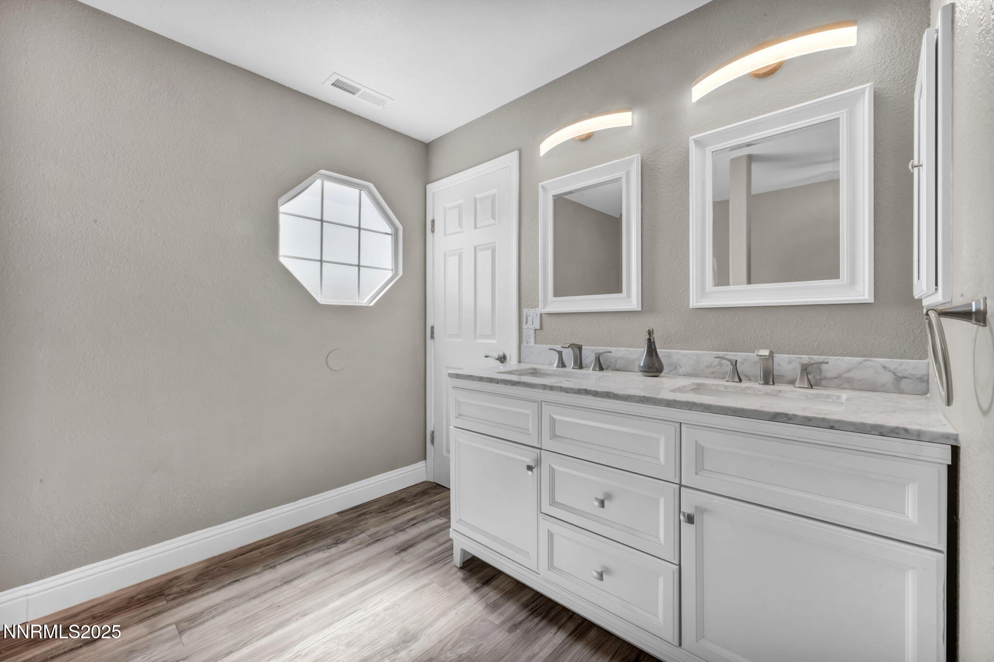 17391 Crystal Canyon Boulevard Reno, NV 89508 - Photo 31 of 63 a bathroom with a sink and a mirror