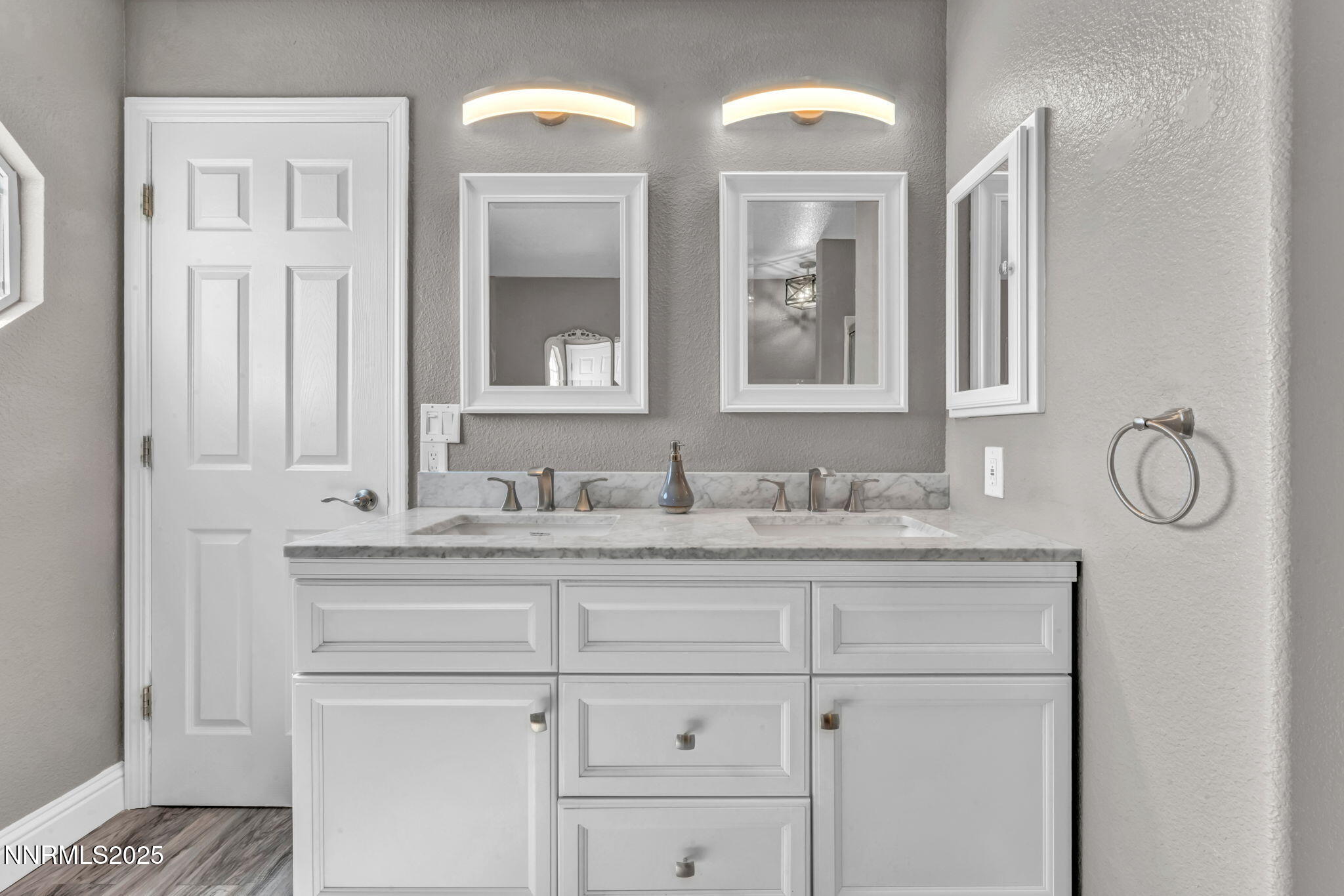 17391 Crystal Canyon Boulevard Reno, NV 89508 - Photo 32 of 63 a bathroom with cabinets two sinks and a window
