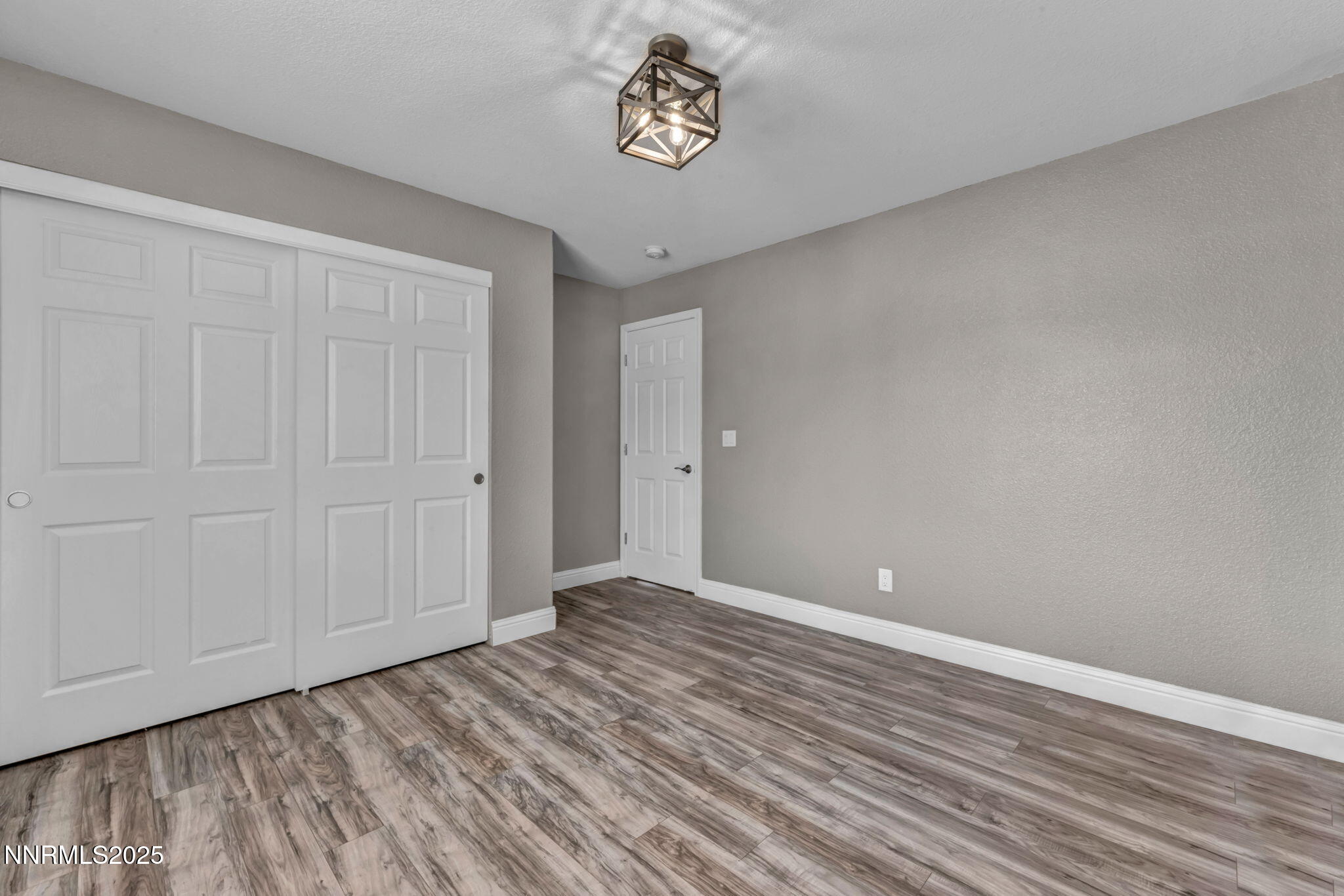 17391 Crystal Canyon Boulevard Reno, NV 89508 - Photo 34 of 63 a view of an empty room with wooden floor